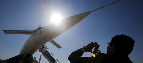 A visitor takes a picture of a Tupolev Tu-144 commercial supersonic transport aircraft on display at the MAKS International Aviation and Space Salon in Zhukovsky, outside Moscow, Russia, August 25, 2015 A visitor takes a picture of a Tupolev Tu-144 commercial supersonic transport aircraft on display at the MAKS International Aviation and Space Salon in Zhukovsky, outside Moscow, Russia, August 25, 2015 - Sputnik International