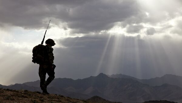 US Army Spc. Newton Carlicci travels dismounted while on his way back to his outpost from the village of Paspajak, Charkh District, Logar province, Afghanistan. File photo - Sputnik International