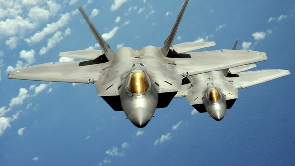 Two US Air Force F-22 Raptor stealth jet fighters fly near Andersen Air Force Base, Guam. File photo - Sputnik International