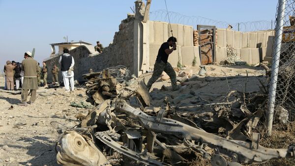 Afghan officials investigate the site of a deadly suicide attack on a joint NATO-Afghan base in the Ghani Khail district of Nangarhar province, east of Jalalabad, Afghanistan. File photo - Sputnik International