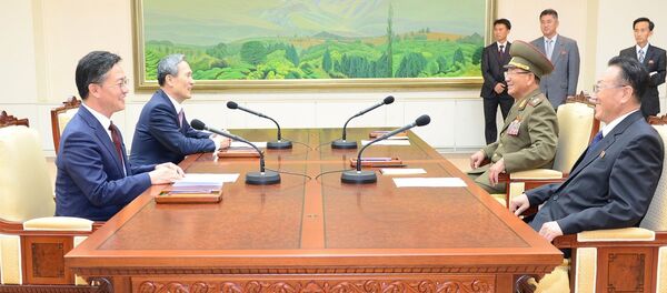 South Korean National Security Adviser Kim Kwan-jin (2nd L), South Korean Unification Minister Hong Yong-pyo (L), Secretary of the Central Committee of the Workers' Party of Korea Kim Yang Gon (R), and Hwang Pyong-so (2nd R), the top military aide to the North's leader Kim Jong Un, talk during the inter-Korean high-level talks at the truce village of Panmunjom inside the Demilitarized Zone separating the two Koreas, in this picture provided by the Unification Ministry and released by Yonhap on August 25, 2015 South Korean National Security Adviser Kim Kwan-jin (2nd L), South Korean Unification Minister Hong Yong-pyo (L), Secretary of the Central Committee of the Workers' Party of Korea Kim Yang Gon (R), and Hwang Pyong-so (2nd R), the top military aide to the North's leader Kim Jong Un, talk during the inter-Korean high-level talks at the truce village of Panmunjom inside the Demilitarized Zone separating the two Koreas, in this picture provided by the Unification Ministry and released by Yonhap on August 25, 2015 - Sputnik International