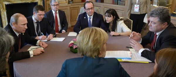 October 17, 2014. Russian President Vladimir Putin (left), Ukrainian President Petro Poroshenko (right), German Chancellor Angela Merkel (near center), and French President Francois Hollande (far center) during a meeting in the Normandy format on the sidelines of the ASEM Summit - Sputnik International