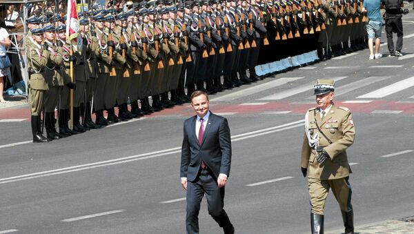 Polish President Andrzej Duda and Chief of Staff Gen. Mieczyslaw Gocul review troops prior to a military parade during Armed Forces Day in Warsaw, Poland August 15, 2015 - Sputnik International