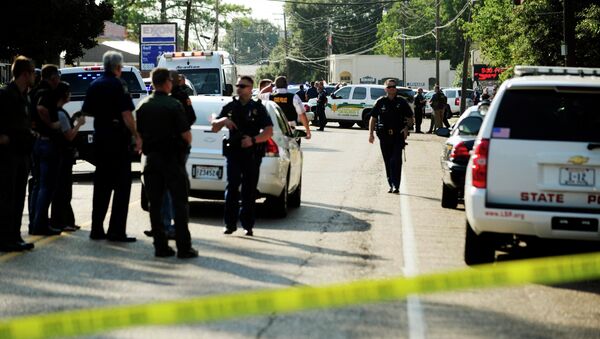 Police officers respond to a barricaded suspect situation following stabbing and shooting incidents in Sunset, Louisiana, August 26, 2015 - Sputnik International