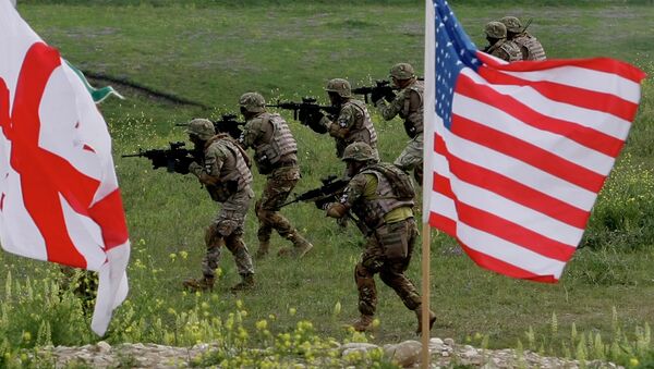 US and Georgian servicemen, with Georgian and US flags in front, take part in the joint US-Georgia military exercise at the Vaziani base outside the Georgian capital, Tbilisi, Georgia, Thursday, May 21, 2015 - Sputnik International