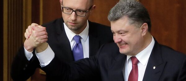 Ukraine's President Petro Poroshenko, right, and Prime Minister Arseniy Yatsenyuk celebrate after Yatsenyuk was appointed the Prime Minister during the opening first session of the Ukrainian parliament in Kiev, Ukraine - Sputnik International