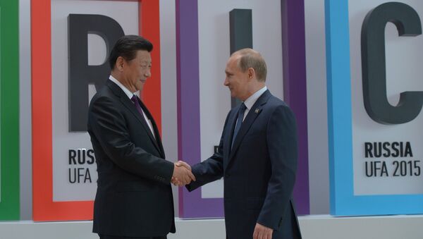 President of the Russian Federation Vladimir Putin, right, and President of the People’s Republic of China Xi Jinping at the welcome ceremony for the BRICS leaders in Ufa - Sputnik International