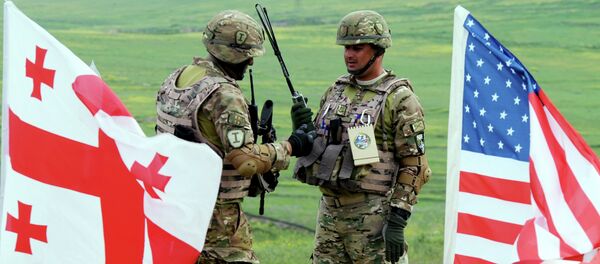 Georgian servicemen takes part in the joint US-Georgian exercise Noble Partner 2015 at the Vaziani training area outside Tbilisi, on May 21, 2015 Georgian servicemen takes part in the joint US-Georgian exercise Noble Partner 2015 at the Vaziani training area outside Tbilisi, on May 21, 2015 - Sputnik International