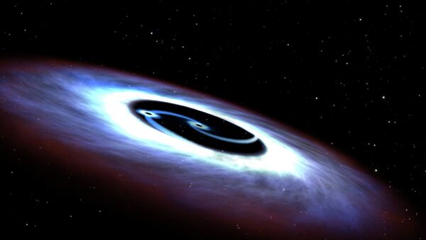 Markarian 231, a binary black hole found in the center of the nearest quasar host galaxy to Earth, is seen in a NASA illustration released August 27, 2015 - Sputnik International