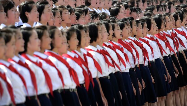 A North Korean student choir sing as part of the celebrations for the anniversary of the Korean War armistice agreement, Sunday, July 27, 2014, in Pyongyang, North Korea - Sputnik International