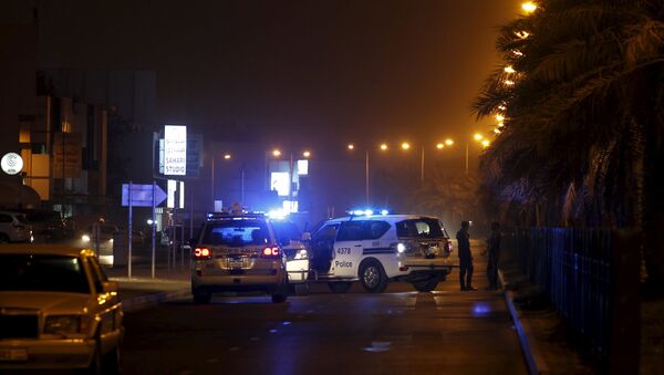 Police cars block the Budaiya highway leading to the blast site where one police officer was killed late Friday evening in Budaiya west of Manama, Bahrain, August 28, 2015. A terrorist blast in a Shi'ite village in Bahrain killed a policeman on Friday, the country's interior ministry said. One policeman killed in the terrorist blast in Karana village, it said on its Twitter account, giving no further details - Sputnik International