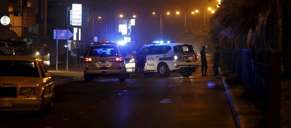 Police cars block the Budaiya highway leading to the blast site where one police officer was killed late Friday evening in Budaiya west of Manama, Bahrain, August 28, 2015. A terrorist blast in a Shi'ite village in Bahrain killed a policeman on Friday, the country's interior ministry said. One policeman killed in the terrorist blast in Karana village, it said on its Twitter account, giving no further details - Sputnik International