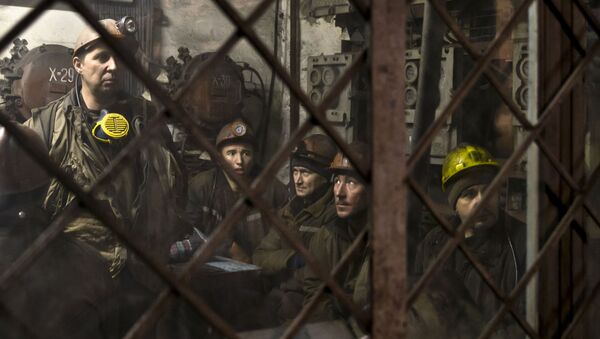 Ukrainian coal miners wait in a room before going underground at the Zasyadko mine in Donetsk, Ukraine - Sputnik International