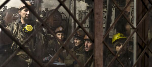 Ukrainian coal miners wait in a room before going underground at the Zasyadko mine in Donetsk, Ukraine Ukrainian coal miners wait in a room before going underground at the Zasyadko mine in Donetsk, Ukraine - Sputnik International