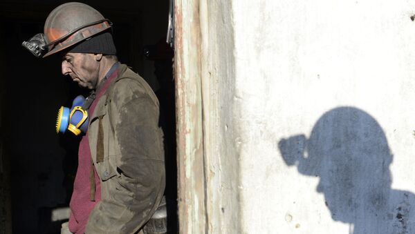 A miner of the Kholodnaya Balka coal mine stands after finishing work, in the eastern Ukrainian city of Makievka, in the Donetsk region, in the self-declared Donetsk People's Republic - Sputnik International