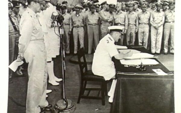 Admiral Sir Bruce Fraser, commanding British Pacific fleet, signs the instrument of surrender on behalf of the United Kingdom. - Sputnik International
