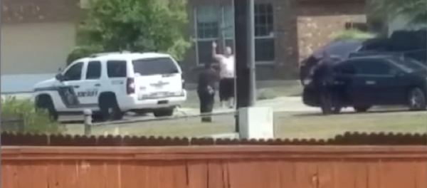 Cell phone video aired by KSAT shows Gilbert Flores standing outside of his San Antonio home Friday during a domestic violence call. In the video, Flores, 41, raises his hands over his head then suddenly collapses to the ground after he is apparently shot by deputies. Cell phone video aired by KSAT shows Gilbert Flores standing outside of his San Antonio home Friday during a domestic violence call. In the video, Flores, 41, raises his hands over his head then suddenly collapses to the ground after he is apparently shot by deputies. - Sputnik International