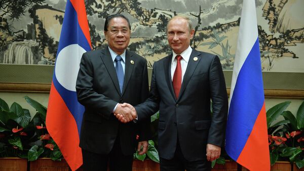 September 3, 2015. Russian President Vladimir Putin, right, and President of the People's Democratic Republic of Laos Choummaly Sayasone meet at the Diaoyutai residence in Beijing. - Sputnik International