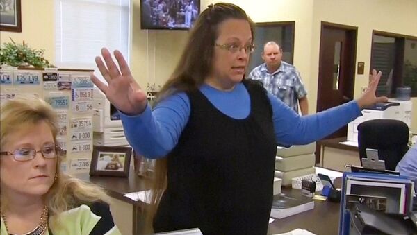 Rowan County Clerk Kim Davis gestures as she refuses to issue marriage licenses to a same-sex couple in Morehead, Kentucky September 1, 2015, in a still image from video provided by WLEX - Sputnik International