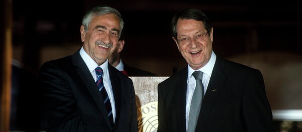 Cypriot President Nicos Anastasiades (R) shakes the hand of Turkish Cypriot President of the self-proclaimed Turkish Republic of Northern Cyprus (TRNC), Mustafa Akinci, following a UN-sponsored meeting at Ledra palace on May 11, 2015 Cypriot President Nicos Anastasiades (R) shakes the hand of Turkish Cypriot President of the self-proclaimed Turkish Republic of Northern Cyprus (TRNC), Mustafa Akinci, following a UN-sponsored meeting at Ledra palace on May 11, 2015 - Sputnik International