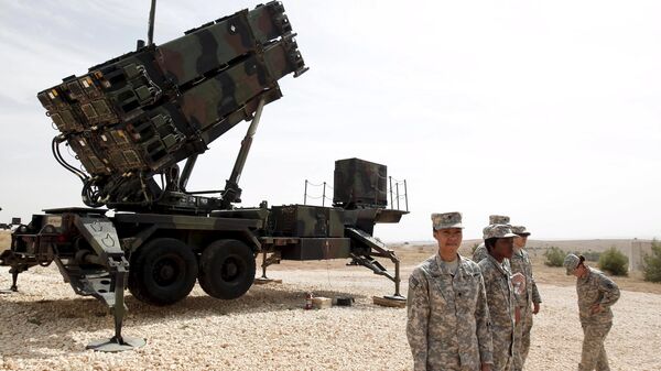 U.S. soldiers stand beside a U.S. Patriot missile system at a Turkish military base in Gaziantep, southeastern Turkey, in this October 10, 2014 file photo - Sputnik International