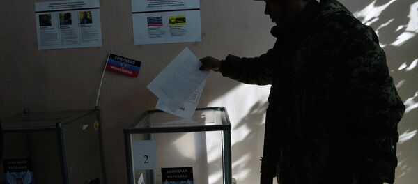 Members of the self-defense forces cast their votes at Polling Station No. 127 during the elections for the leader and the People's Council of the Donetsk People's Republic. Members of the self-defense forces cast their votes at Polling Station No. 127 during the elections for the leader and the People's Council of the Donetsk People's Republic. - Sputnik International