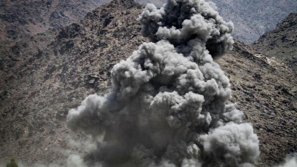 Smoke rises after a coalition air strike against a building believed occupied by Taliban fighters in Kuz Kunar, Nangarhar province east of Kabul. - Sputnik International