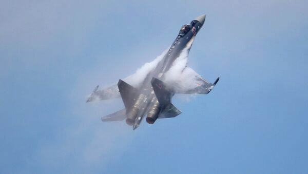 A Sukhoi SU-35 jetfigther performs its demonstration flight during the 50th Paris Air Show at Le Bourget airport, north of Paris, Thursday, June 20, 2013 - Sputnik International