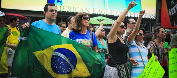 Demonstrators shout slogans against Brazil's President Dilma Rousseff while they attend a protest at Times Square in New York August 16, 2015 Demonstrators shout slogans against Brazil's President Dilma Rousseff while they attend a protest at Times Square in New York August 16, 2015 - Sputnik International