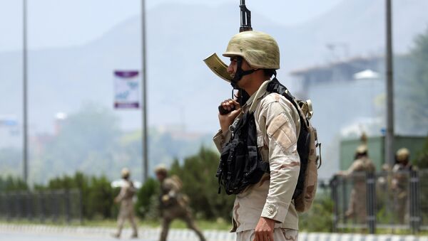 Afghan security forces gather at the site of an attack by Taliban fighters outside the parliament in Kabul, Afghanistan, Monday, June 22, 2015 - Sputnik International