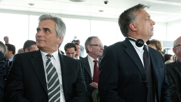 Hungarian Prime Minister Viktor Orbán sits with Austrian Chancellor Werner Faymann on June 12, 2012 during his visit to Vienna - Sputnik International