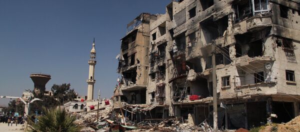 A damaged residential building in the Yarmouk refugee camp on the outskirts of Damascus A damaged residential building in the Yarmouk refugee camp on the outskirts of Damascus - Sputnik International