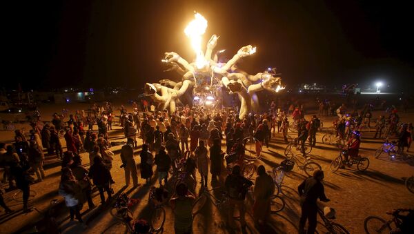 Participants gather at Medusa Madness during the Burning Man 2015 Carnival of Mirrors arts and music festival in the Black Rock Desert of Nevada, September 6, 2015 - Sputnik International