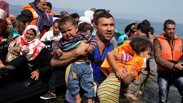 Syrian refugees arrive aboard a dinghy after crossing from Turkey to the island of Lesbos, Greece, Thursday, Sept. 10, 2015. The US is making plans to accept 10,000 Syrian refugees in the coming budget year - Sputnik International