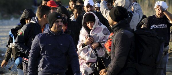Migrants walk towards the transit camp in Gevgelija, Macedonia, after entering the country by crossing the border with Greece, September 12, 2015 Migrants walk towards the transit camp in Gevgelija, Macedonia, after entering the country by crossing the border with Greece, September 12, 2015 - Sputnik International