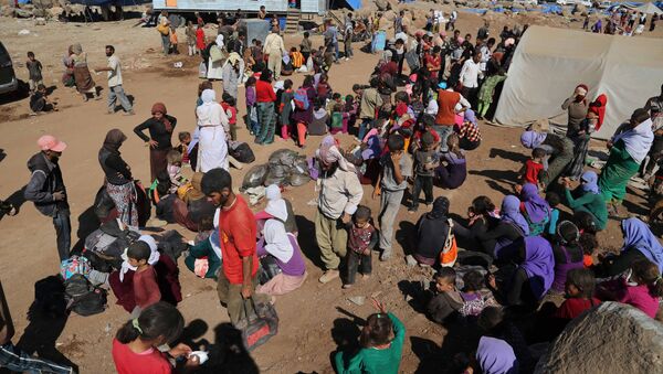 Displaced Iraqis from the Yazidi community arrive at Nowruz camp, in Derike, Syria, Tuesday, Aug. 12, 2014 - Sputnik International