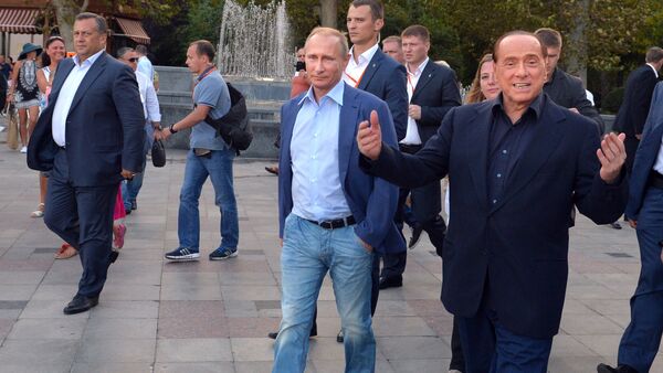 Russian President Vladimir Putin (3rd R) and Italy's former prime minister Silvio Berlusconi (R) walk along the Yalta embankment in Crimea on September 11, 2015 - Sputnik International