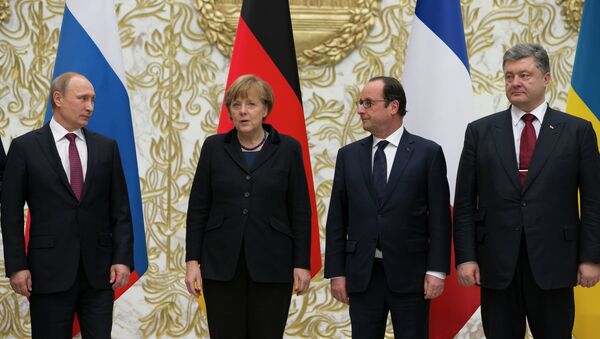 From the left : Russian President Vladimir Putin, German Chancellor Angela Merkel, French President Francois Hollande, and Ukrainian President Petro Poroshenko pose for a photo during a time-break in their peace talks in Minsk, Belarus, Wednesday, Feb. 11, 2015. Leaders of Russia, Ukraine, France and Germany are gathering for crucial talks in the hope of negotiating an end fighting between Russia-backed separatist and government forces in eastern Ukraine. - Sputnik International