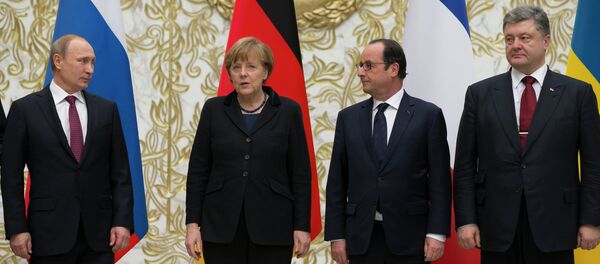 From the left : Russian President Vladimir Putin, German Chancellor Angela Merkel, French President Francois Hollande, and Ukrainian President Petro Poroshenko pose for a photo during a time-break in their peace talks in Minsk, Belarus, Wednesday, Feb. 11, 2015. Leaders of Russia, Ukraine, France and Germany are gathering for crucial talks in the hope of negotiating an end fighting between Russia-backed separatist and government forces in eastern Ukraine. From the left : Russian President Vladimir Putin, German Chancellor Angela Merkel, French President Francois Hollande, and Ukrainian President Petro Poroshenko pose for a photo during a time-break in their peace talks in Minsk, Belarus, Wednesday, Feb. 11, 2015. Leaders of Russia, Ukraine, France and Germany are gathering for crucial talks in the hope of negotiating an end fighting between Russia-backed separatist and government forces in eastern Ukraine. - Sputnik International