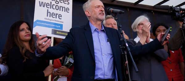 Newly elected leader of Britain's opposition Labour party, Jeremy Corbyn (C), addresses a rally pro-refugee rally in central London on September 12, 2015 Newly elected leader of Britain's opposition Labour party, Jeremy Corbyn (C), addresses a rally pro-refugee rally in central London on September 12, 2015 - Sputnik International