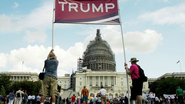 Supporters of US Republican Presidential hopeful Donald Trump hold up a sign during a Tea Party rally against the international nuclear agreement with Iran outside the US Capitol in Washington, DC on September 9, 2015 - Sputnik International