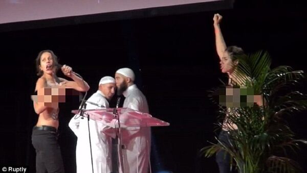 Two topless feminists storm Muslim conference stage in France - Sputnik International