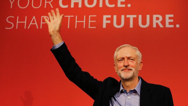 Jeremy Corbyn waves on stage after new is announced as the new leader of The Labour Party during the Labour Party Leadership Conference in London, Saturday, Sept. 12, 2015. Corbyn will now lead Britain's main opposition party. - Sputnik International