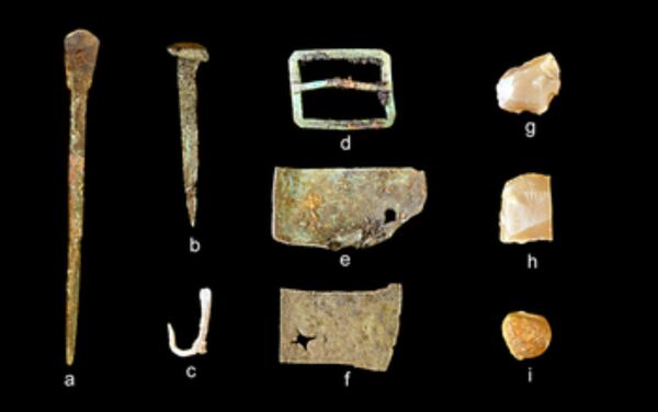 A representative collection of artifacts discovered in July 2015 includes (from left) part of a set of dividers, a nail, a fishhook, a buckle, sheet copper, gun flints and a musket ball - Sputnik International