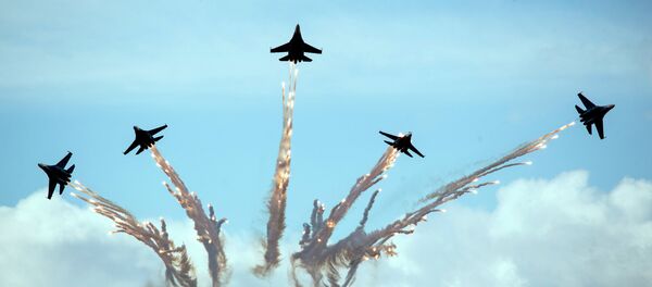 Su-27 jets of aerobatics team Russkiye Vityasy, or Russian Knights, perform during the MAKS-2015 International Aviation and Space Show in Zhukovsky, outside Moscow, Russia, Sunday, Aug. 30, 2015. Su-27 jets of aerobatics team Russkiye Vityasy, or Russian Knights, perform during the MAKS-2015 International Aviation and Space Show in Zhukovsky, outside Moscow, Russia, Sunday, Aug. 30, 2015. - Sputnik International