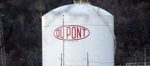 A storage tank for a Dupont plant is reflected in the Kanawha River in Marmet, W.Va. A storage tank for a Dupont plant is reflected in the Kanawha River in Marmet, W.Va. - Sputnik International