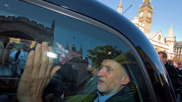 Newly elected leader of Britain's opposition Labour party, Jeremy Corbyn, passes the Houses of Parliament and Big Ben as he leaves in the back of a taxi after addressing a pro-refugee rally in central London on September 12, 2015. - Sputnik International