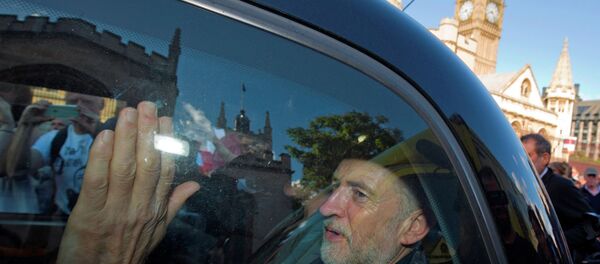 Newly elected leader of Britain's opposition Labour party, Jeremy Corbyn, passes the Houses of Parliament and Big Ben as he leaves in the back of a taxi after addressing a pro-refugee rally in central London on September 12, 2015. Newly elected leader of Britain's opposition Labour party, Jeremy Corbyn, passes the Houses of Parliament and Big Ben as he leaves in the back of a taxi after addressing a pro-refugee rally in central London on September 12, 2015. - Sputnik International