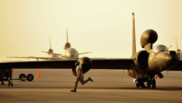 A member of the 380th Expeditionary Aircraft Maintenance Squadron assists in the removal of the temporary landing gear on a U-2. - Sputnik International