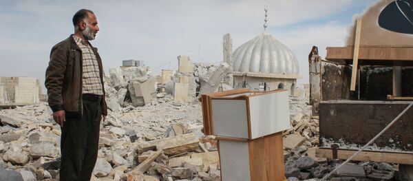 Syrian man salvages furniture from his home that was destroyed in bombing, in the northwestern city of Maraat al-Numan, Syria Syrian man salvages furniture from his home that was destroyed in bombing, in the northwestern city of Maraat al-Numan, Syria - Sputnik International